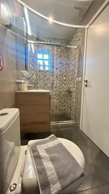 a bathroom with a toilet and a sink and a shower at Καλαίσθητο Ηλιόλουστο Studio in Chania Town