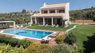 a house with a swimming pool in the yard at Marathi Hilltop Oasis Sea View Villa in Marathi