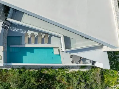 an overhead view of a house with a swimming pool at Bella Casa - Newly Built Designer Villa in Kalyves