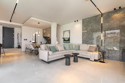 a living room with a couch and a fireplace at Bella Casa - Newly Built Designer Villa in Kalyves