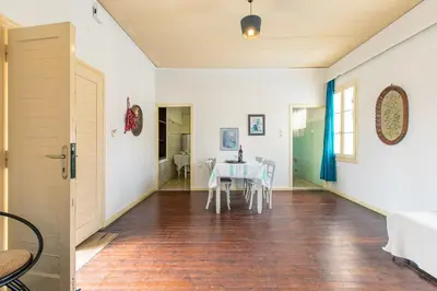 a dining room with a table and chairs at The Orestis Old Cottage House in Stalos