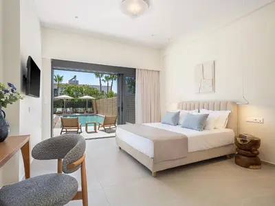 a bedroom with a bed and a balcony with a pool at Villa Thimi - Luxury Family Villa - Private Pool in Korakiaí