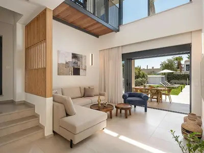a living room with a couch and a table at Villa Thimi - Luxury Family Villa - Private Pool in Korakiaí