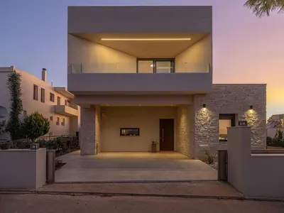 a house with a walkway in front of it at Villa Thimi - Luxury Family Villa - Private Pool in Korakiaí