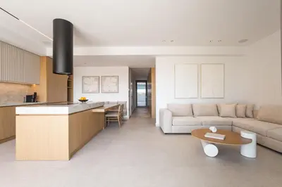 a kitchen and living room with a couch and a table at Memoire Guest House I Private Heated Pool I 200m beach in Chania Town