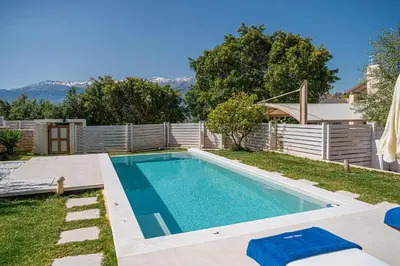 a swimming pool in the backyard of a house at Villa Crista in Áptera