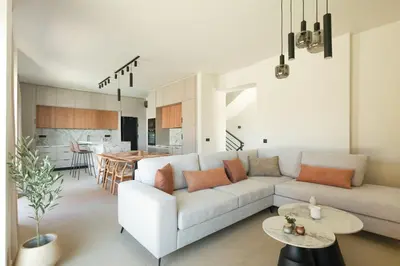 a living room with a couch and a table at Madre Tierra Boutique Villa 2 in Liyidhés