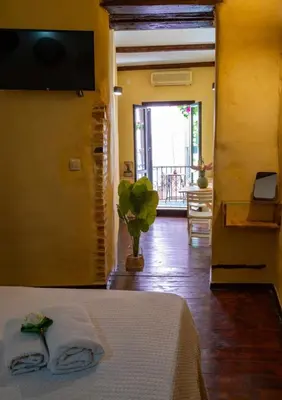a bedroom with a bed with two towels on it at Mythos -Old Town-Old harbour Chania in Chania Town