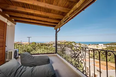 a balcony with a view of the ocean at Zen Maisonette Retreat in Daratso