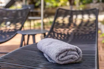 a towel is sitting on top of a table at 6622 Luxury Apartment with Shared Pool in Chania Town