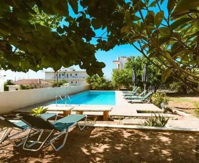 a pool with a bunch of chairs and a bunch ofituresitures at 6622 Luxury Apartment with Shared Pool in Chania Town