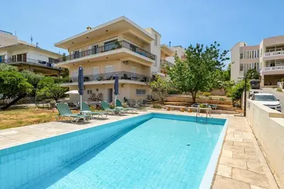 a swimming pool in front of a building at 6622 Luxury Apartment with Shared Pool in Chania Town