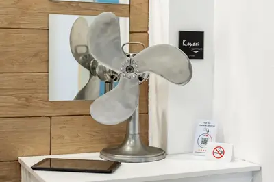 a metal fan on top of a table at Kamari Apartment - Chania in Chania Town