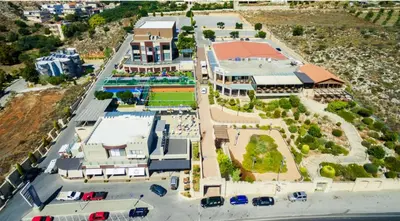 an aerial view of a building with a tennis court at Kamari Apartment - Chania in Chania Town
