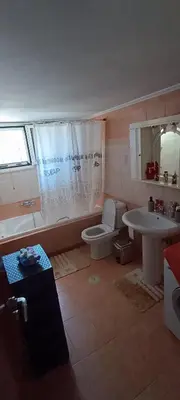 a bathroom with a toilet and a sink at casa di Beatrice in Georgioupolis