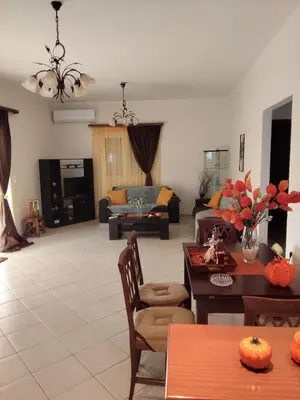 a living room with a couch and a table at casa di Beatrice in Georgioupolis