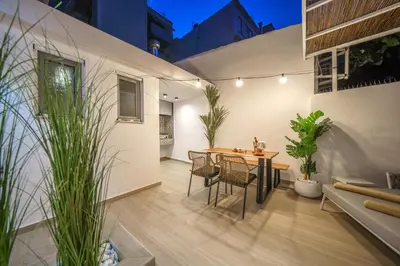 a dining room with a table and chairs at OLYMPIA Luxury Apartment in Chania Town