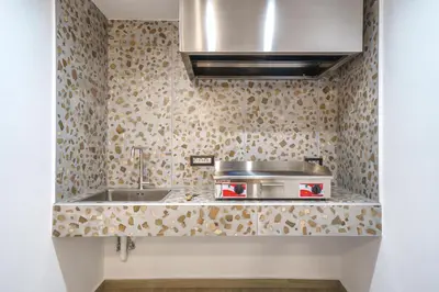 a kitchen with a sink and a stove at OLYMPIA Luxury Apartment in Chania Town