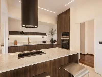 a kitchen with a large island with a sink at Aeri Residence in Chania Town