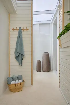 a hallway with a towel and a basket of towels at Atria Serenity Stay in Chania Town