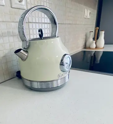 a tea kettle sitting on a counter in a kitchen at AmaliZen, Steps From The Sea in Chania Town