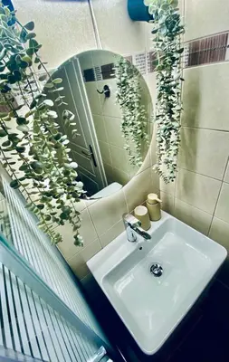 a bathroom with a sink and a mirror at AmaliZen, Steps From The Sea in Chania Town