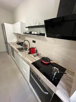 a kitchen with a sink and a stove top oven at Quiet Nest apartment in Koumpeli