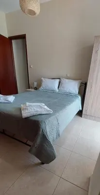 a bedroom with a bed with a towel on it at Souda Bay View Retreat in Souda