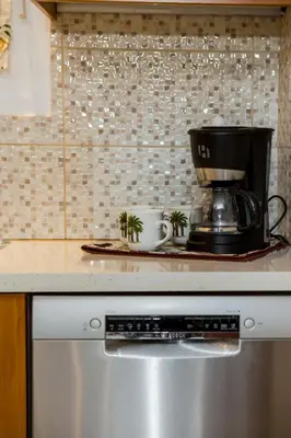 a coffee maker sitting on top of a kitchen appliance at Theodosia Heritage Residence in Kissamos