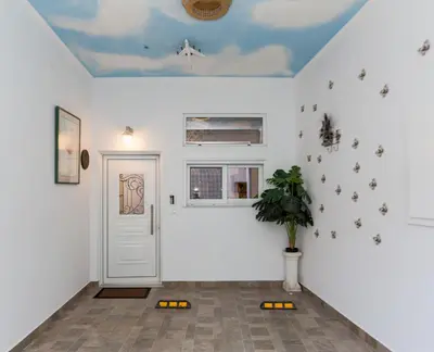 a room with a white wall with a ceiling at Theodosia Heritage Residence in Kissamos