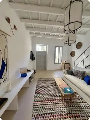 a living room with a couch and a rug at Filoi Rooftop Boutique House,5pax in Chania Town
