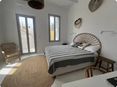 a bedroom with a large bed and a large rug at Filoi Rooftop Boutique House,5pax in Chania Town