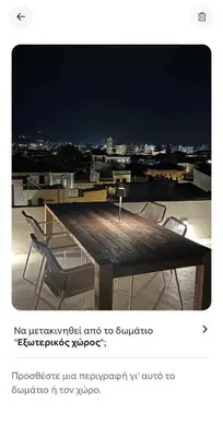a table and chairs sitting on top of a roof at Filoi Rooftop Boutique House,5pax in Chania Town