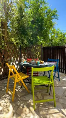 a table and two chairs and a table and chairs at SeawoodBreeze - Sea view and Quiet Escape in Tavronitis