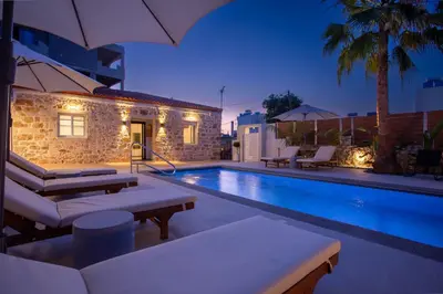 a villa with a swimming pool at night at Be Crete - Villa Del Sol in Chania Town