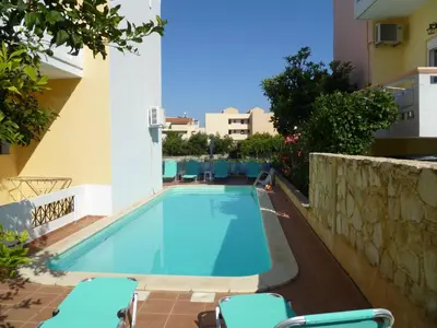a swimming pool in the middle of a building at Anniko in Stalos