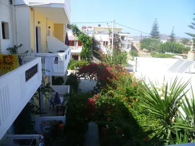 a view from the balcony of a house with flowers at Anniko in Stalos