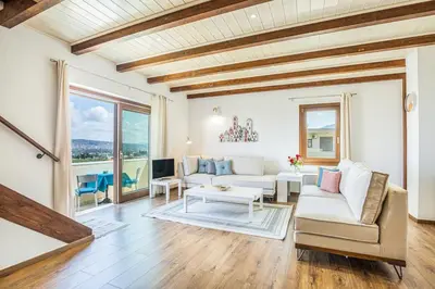 a living room with a couch and a table at Villa Rose in Chania Town