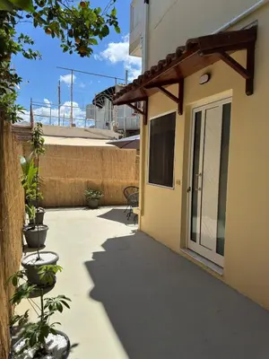 a walkway leading to the door of a house at Unique Apartment 3 in Chania Town