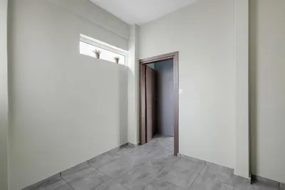 an empty room with a door and a hallway at Litsa's Maisonette Near Sea - City Center in Chania Town