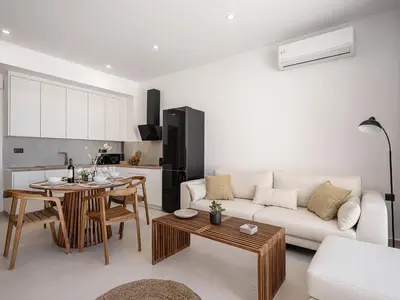 a living room with a couch and a table at Petra Retreat Residence in Daratso