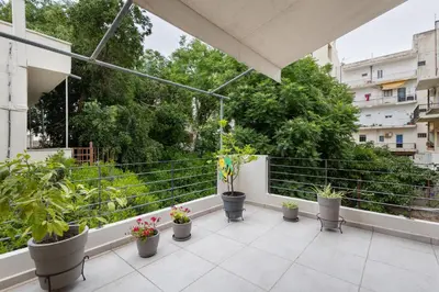 a balcony with potted plants on a building at Architects Oasis in Chania Town