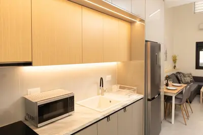 a kitchen with a sink and a microwave on a counter at Ikaros City Loft in Chania Town