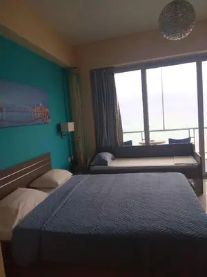 a hotel room with a bed and a window at Blue Studios in Chania Town