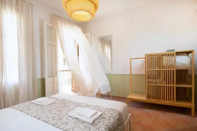 a bedroom with a bed with two towels on it at Artemis House in Chania Town