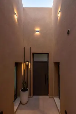 a hallway with a door and a potted plant at Villa Tierra in Kissamos