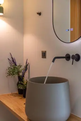 a bowl on a counter with a lamp and a mirror at Villa Tierra in Kissamos