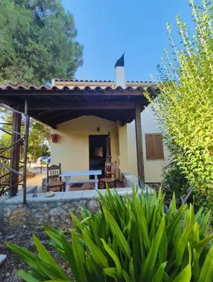 a patio with a table in front of a house at Kalives pearl suite in Kalyves