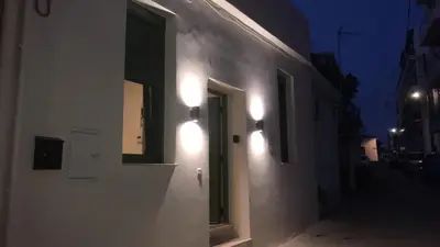 a white building with lights on the side of it at Casa di Keti in Chania Town