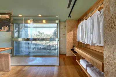 a bathroom with a glass shower and a window at New Luxury Olives & Thyme Retreat, Seaview with 2 Heated Pools in Chania Town